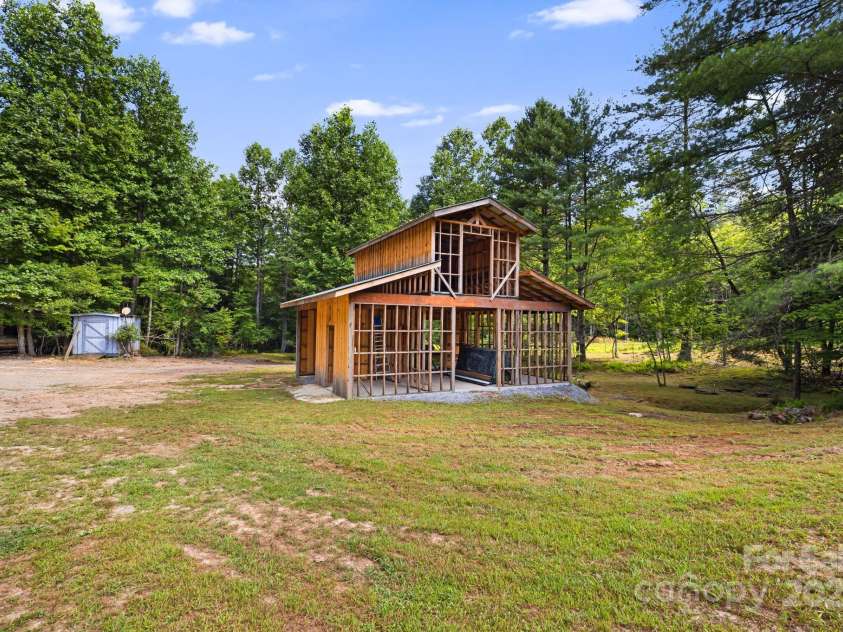 1101 Line Runner Ridge Road, Rosman, NC 28772.  MLS# CAR4280963, YatesRealty ID 27502. Side view of unfinished barn