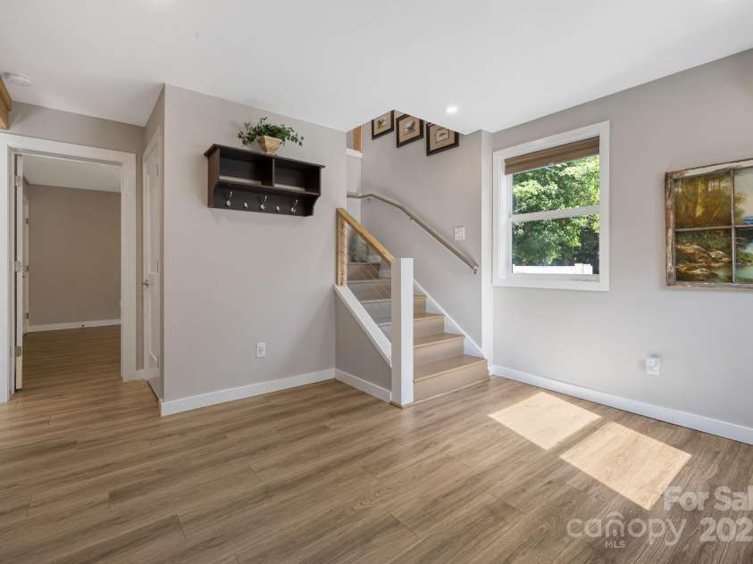 1101 Line Runner Ridge Road, Rosman, NC 28772.  MLS# CAR4280963, YatesRealty ID 27502. Stairs to lower level flex space