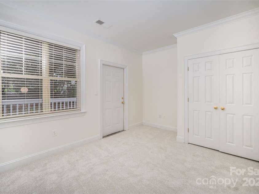 5617 Fairview Road, Charlotte, NC 28209.  MLS# CAR4315083, YatesRealty ID 27510. Guest Bedroom 1 Opens Onto Patio