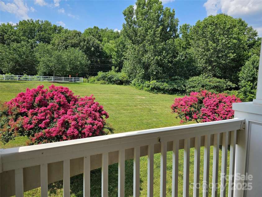 17119 Doe Valley Court, Cornelius, NC 28031.  MLS# CAR4263849, YatesRealty ID 27519. This peaceful view, great porch for relaxing.  Generously sized storage room