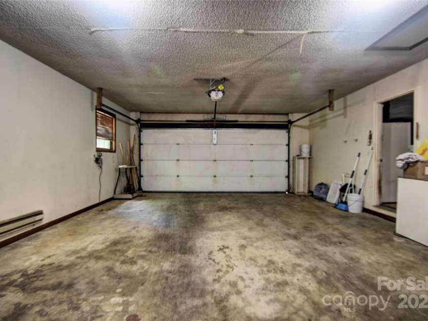 501 Locust Grove Drive, Waynesville, NC 28785.  MLS# CAR4282099, YatesRealty ID 27527. Alternate photo of the double garage