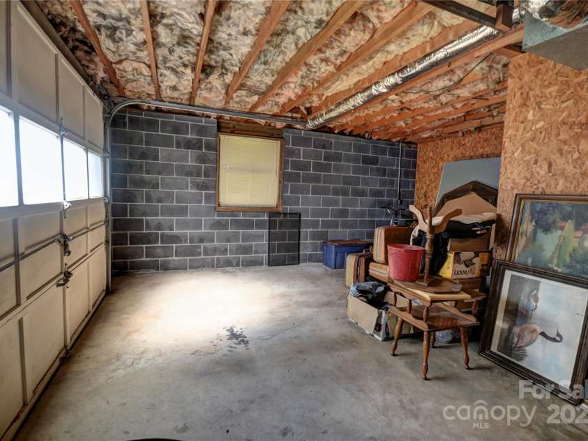 501 Locust Grove Drive, Waynesville, NC 28785.  MLS# CAR4282099, YatesRealty ID 27527. Basement Garage