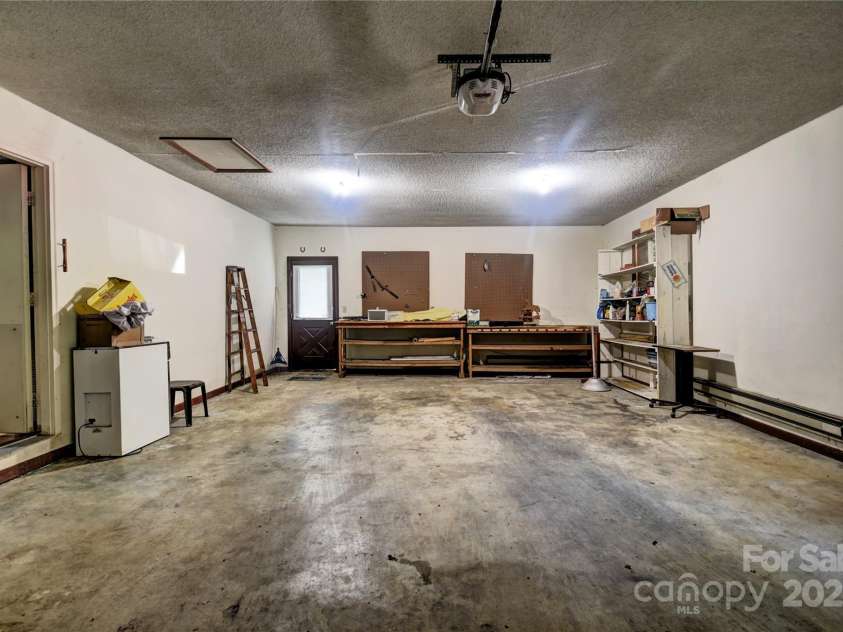 501 Locust Grove Drive, Waynesville, NC 28785.  MLS# CAR4282099, YatesRealty ID 27527. Double Garage on the main level