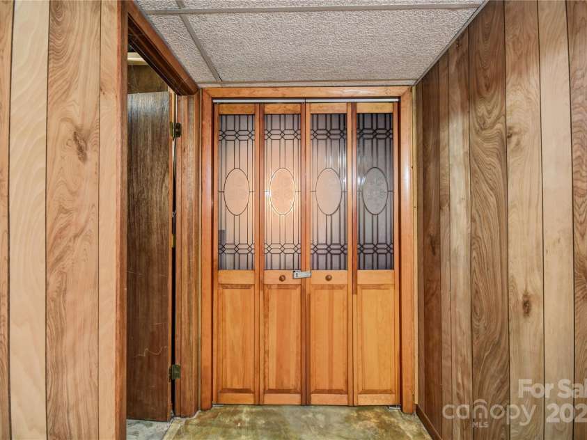 501 Locust Grove Drive, Waynesville, NC 28785.  MLS# CAR4282099, YatesRealty ID 27527. Entrance door to a partially finished room
