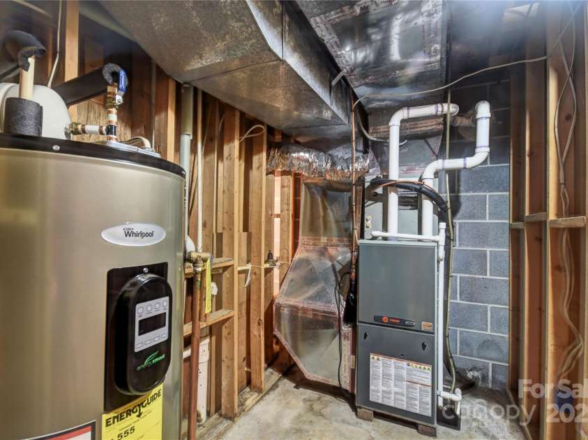 501 Locust Grove Drive, Waynesville, NC 28785.  MLS# CAR4282099, YatesRealty ID 27527. Mechanical room in the basement- water heater and propane furnace/air-handler