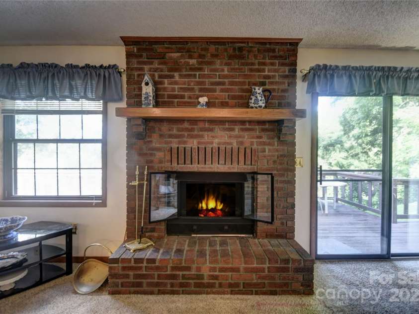501 Locust Grove Drive, Waynesville, NC 28785.  MLS# CAR4282099, YatesRealty ID 27527. Propane gas log fireplace (simulated flames)