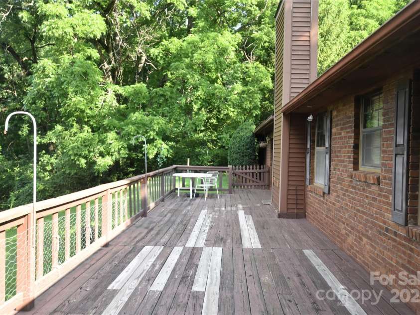 501 Locust Grove Drive, Waynesville, NC 28785.  MLS# CAR4282099, YatesRealty ID 27527. Rear Deck has had some boards replaced, but needs staining