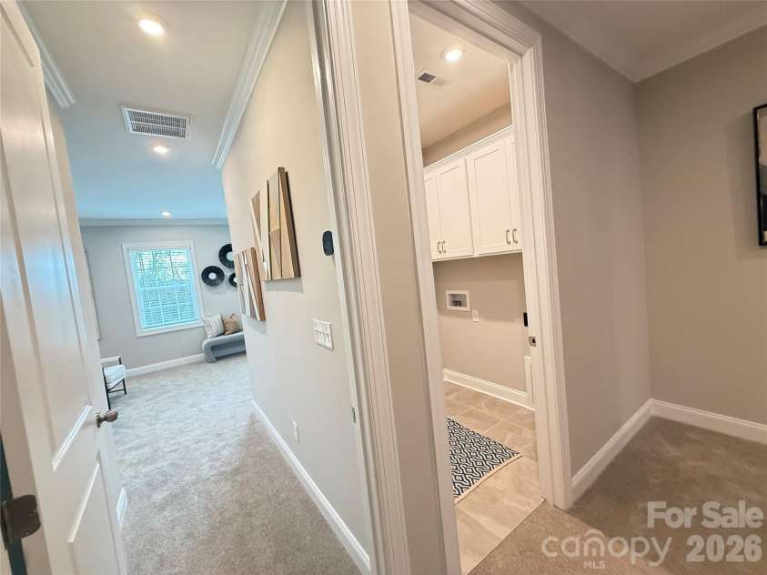12046 Lavinia Lane, Charlotte, NC 28277.  MLS# CAR4280776, YatesRealty ID 27535. View of Entry to Primary Suite Next to Laundry Room