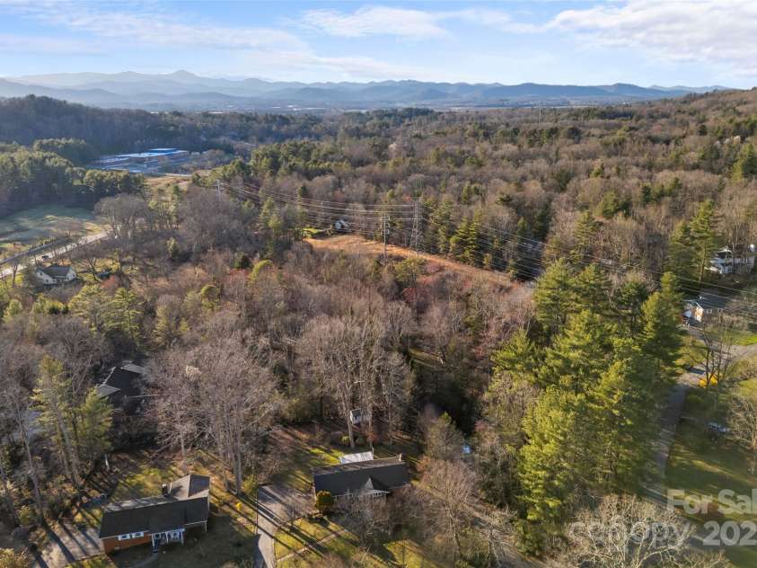 123 Castleton Lane, Hendersonville, NC 28791.  MLS# CAR4237756, YatesRealty ID 2754. Aerial overlooking property from above
