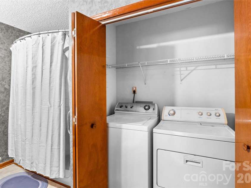 1404 Wellington Hills Circle, Salisbury, NC 28147.  MLS# CAR4383791, YatesRealty ID 27540. Laundry closet in primary bathroom.