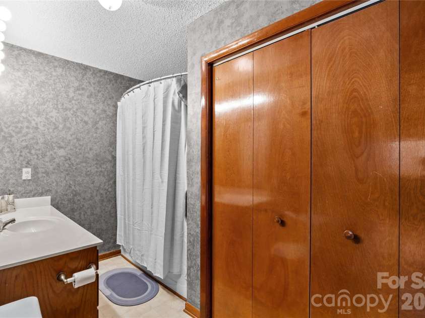 1404 Wellington Hills Circle, Salisbury, NC 28147.  MLS# CAR4383791, YatesRealty ID 27540. Primary bathroom with laundry closet.