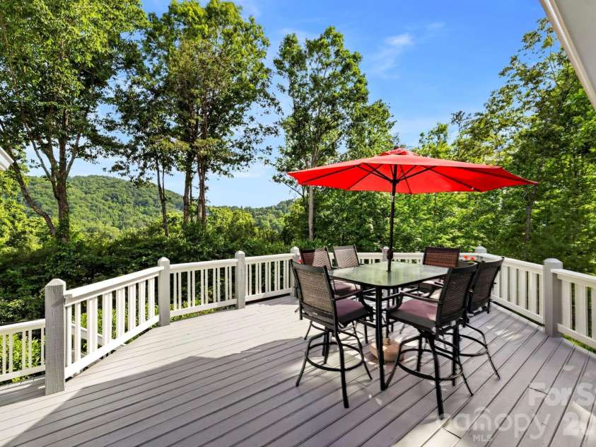 152 Skyview Circle, Asheville, NC 28804.  MLS# CAR4384126, YatesRealty ID 27544. Spanning back deck great for entertaining or evening dinners outside