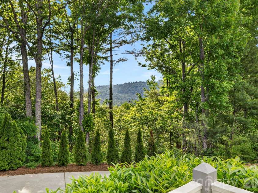 152 Skyview Circle, Asheville, NC 28804.  MLS# CAR4384126, YatesRealty ID 27544. View peeks from every angle in the summer