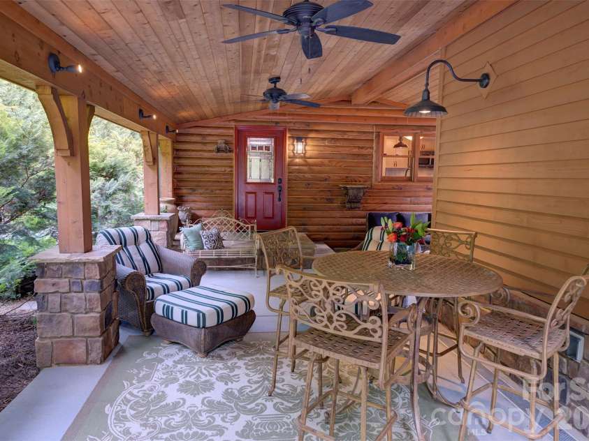 15425 Rocky River Road, Davidson, NC 28036.  MLS# CAR4382327, YatesRealty ID 27548. Back porch from stone fireplace at back driveway