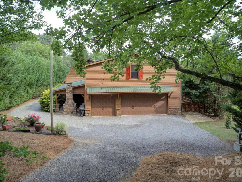 15425 Rocky River Road, Davidson, NC 28036.  MLS# CAR4382327, YatesRealty ID 27548. Back yard to garage & porch