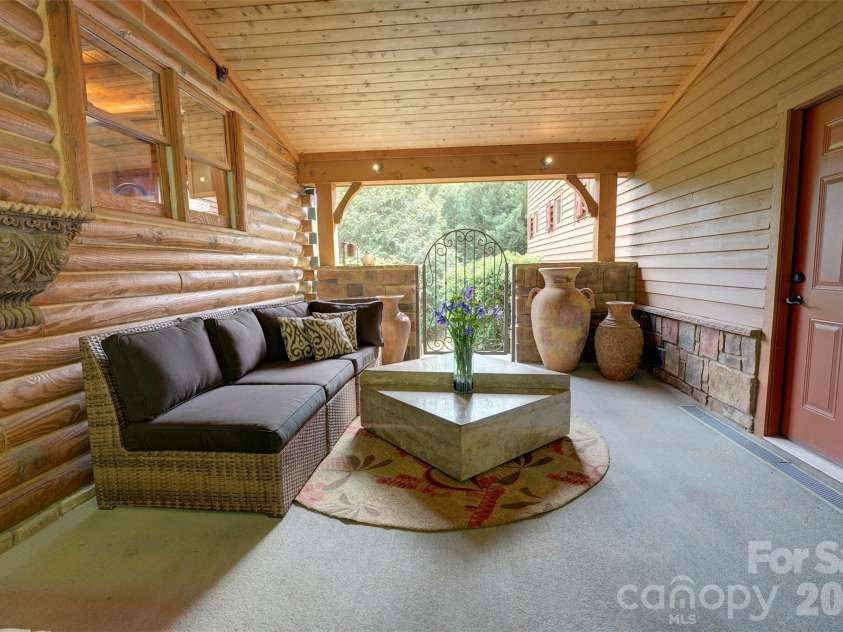 15425 Rocky River Road, Davidson, NC 28036.  MLS# CAR4382327, YatesRealty ID 27548. Porch area between garage and cabin