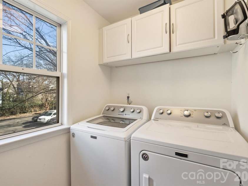 1144 1st Street, Charlotte, NC 28202.  MLS# CAR4336221, YatesRealty ID 2755. Laundry Room with New Flooring and Light Fixture