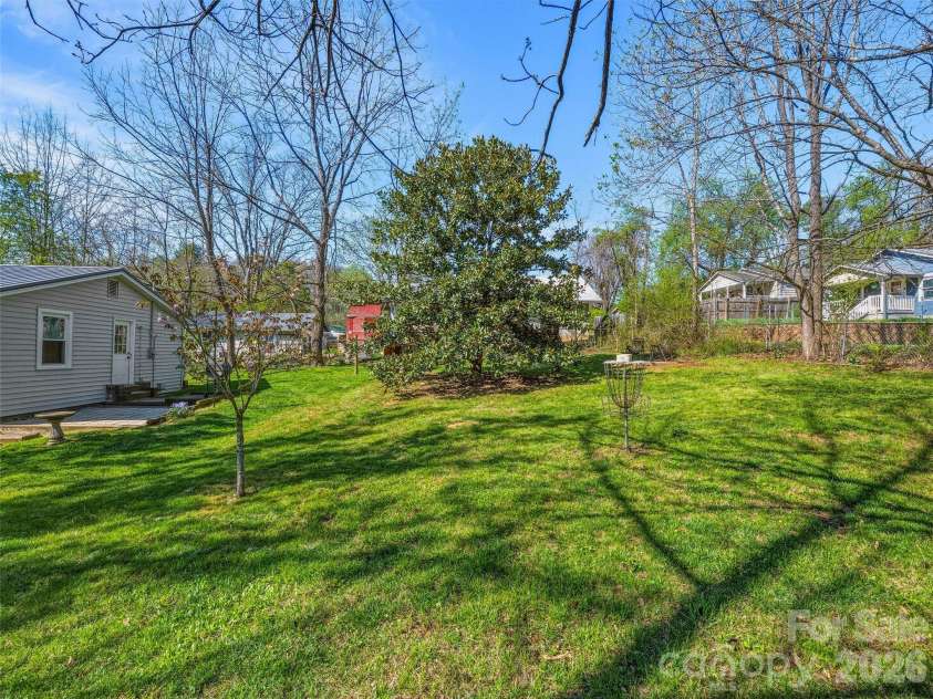 125 Lower Edgewood Road, Candler, NC 28715.  MLS# CAR4371013, YatesRealty ID 27557. Expansive green for your enjoyment!