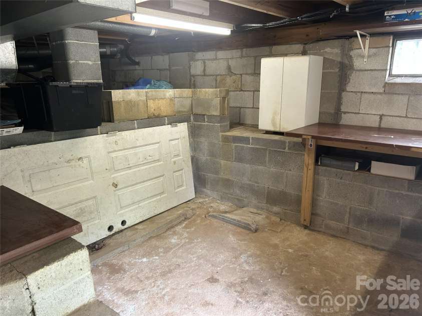 125 Lower Edgewood Road, Candler, NC 28715.  MLS# CAR4371013, YatesRealty ID 27557. Spacious basement storage available.