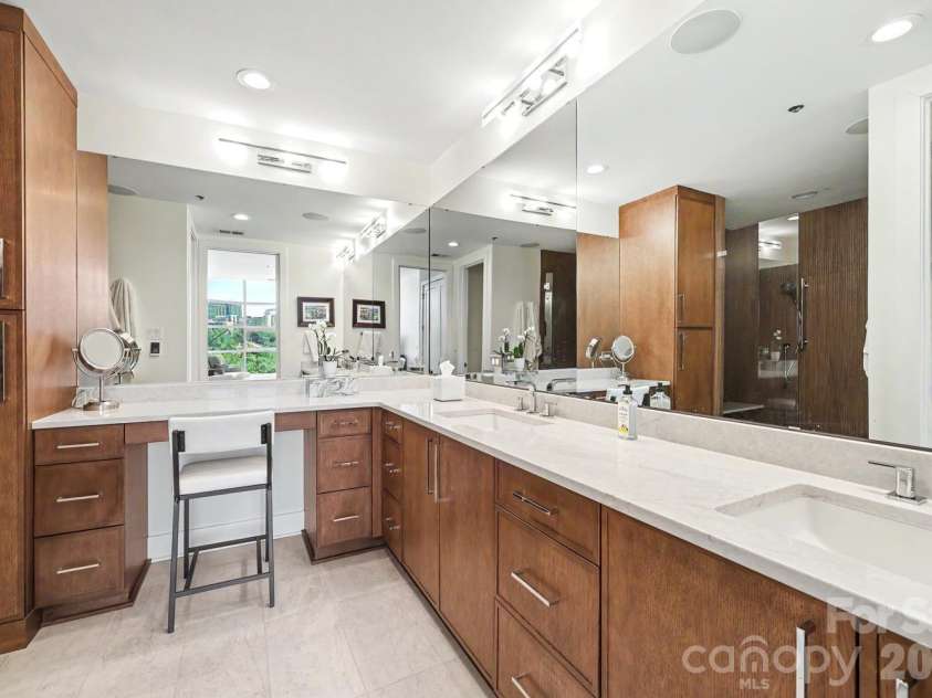 1100 Metropolitan Avenue, Charlotte, NC 28204.  MLS# CAR4378090, YatesRealty ID 27565. Beautiful remodeled bath with dual sinks, custom cabinetry, mirrors and lighting