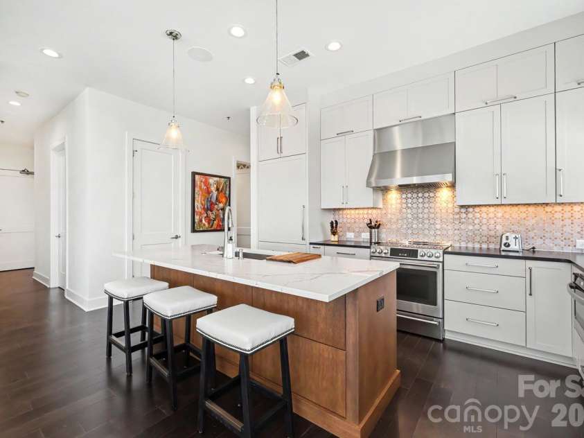 1100 Metropolitan Avenue, Charlotte, NC 28204.  MLS# CAR4378090, YatesRealty ID 27565. Gorgeous remodeled kitchen with custom cabinetry, high end appliances, countertops and backsplash