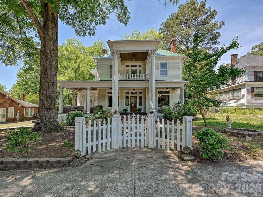 702 Hayne Street, Monroe, NC 28112.  MLS# CAR4376608, YatesRealty ID 27571. Beautifully preserved historic façade blending timeless elegance with welcoming Southern charm.