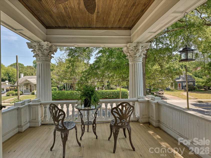 702 Hayne Street, Monroe, NC 28112.  MLS# CAR4376608, YatesRealty ID 27571. Covered upper porch offering a peaceful setting to enjoy the surrounding neighborhood views.