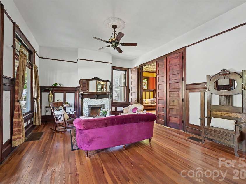 702 Hayne Street, Monroe, NC 28112.  MLS# CAR4376608, YatesRealty ID 27571. Gracious formal living space showcasing original hardwood floors and soaring ceilings.