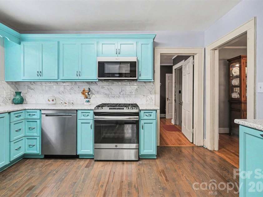 720 Sumter Street, Shelby, NC 28150.  MLS# CAR4367806, YatesRealty ID 27575. This vibrant kitchen has been updated with new cabinetry. **Range currently in home is different from photos.