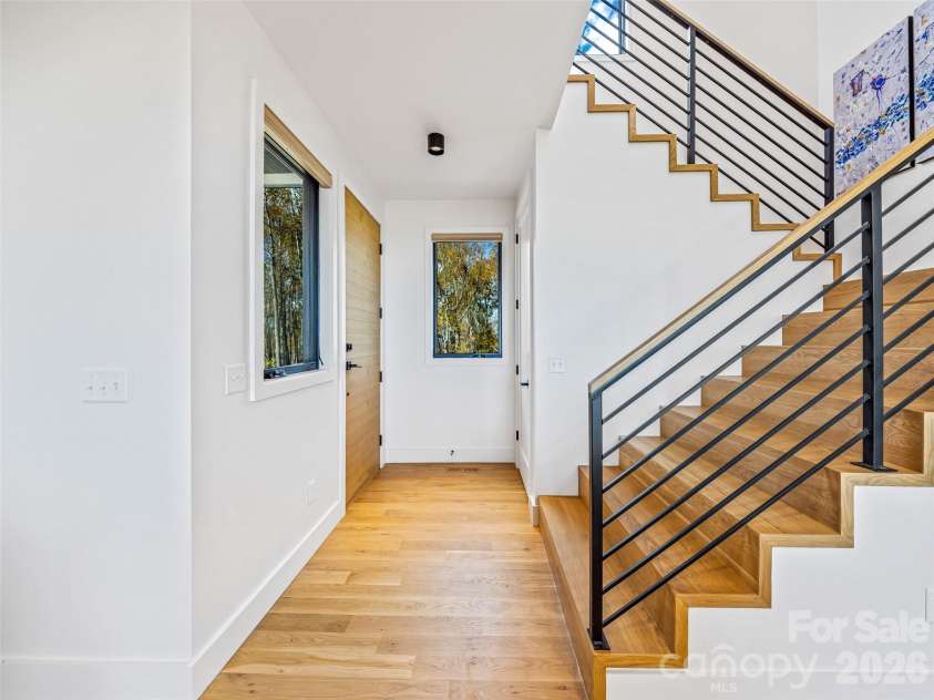 15 Laurel Ledge Way, Fletcher, NC 28732.  MLS# CAR4316029, YatesRealty ID 2758. Access the main level, upstairs, or downstairs terrace level from the foyer.