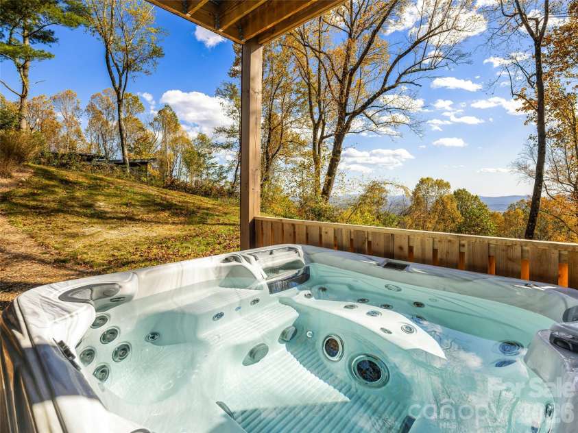 15 Laurel Ledge Way, Fletcher, NC 28732.  MLS# CAR4316029, YatesRealty ID 2758. Bask in the views while enjoying the hot water and jets!