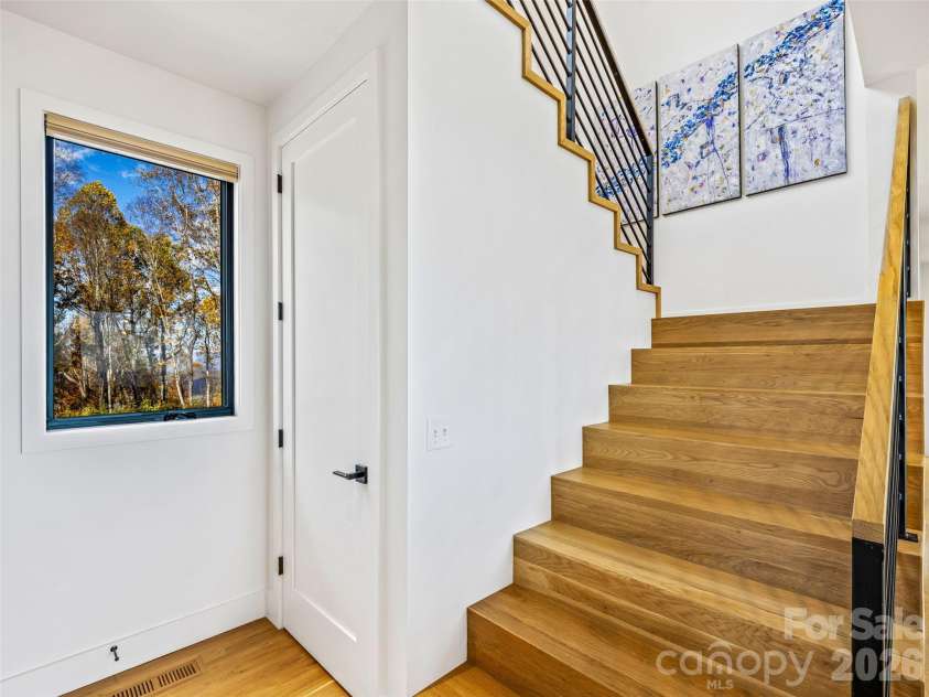 15 Laurel Ledge Way, Fletcher, NC 28732.  MLS# CAR4316029, YatesRealty ID 2758. Door downstairs on the left, and upstairs to the right.