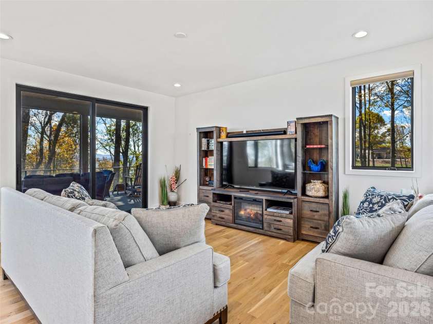 15 Laurel Ledge Way, Fletcher, NC 28732.  MLS# CAR4316029, YatesRealty ID 2758. Enjoy a movie or televised game, or head out to the covered deck!