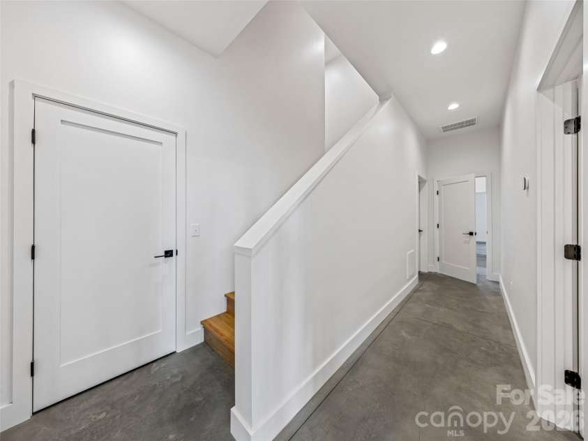 15 Laurel Ledge Way, Fletcher, NC 28732.  MLS# CAR4316029, YatesRealty ID 2758. Heading down to the terrace level.