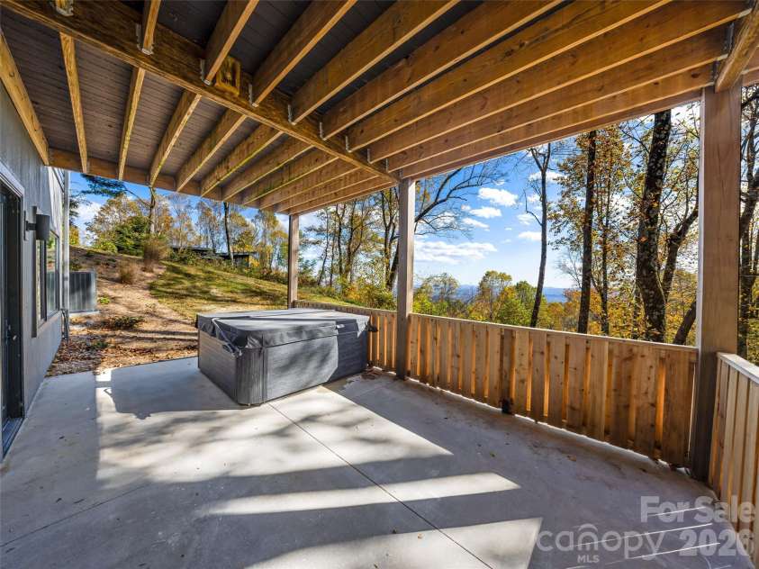 15 Laurel Ledge Way, Fletcher, NC 28732.  MLS# CAR4316029, YatesRealty ID 2758. Terrace level patio with hot tub.