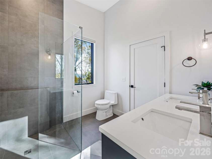 15 Laurel Ledge Way, Fletcher, NC 28732.  MLS# CAR4316029, YatesRealty ID 2758. Upstairs bathroom. Light and bright with room for two at the vanity.