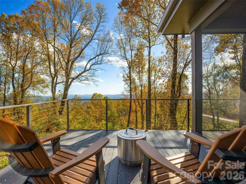 15 Laurel Ledge Way, Fletcher, NC 28732.  MLS# CAR4316029, YatesRealty ID 2758. Want to grill or just need to see the stars? Head out to the uncovered portion of the deck.
