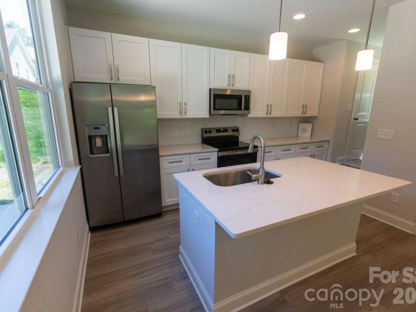 209 James Street, Kannapolis, NC 28083.  MLS# CAR4384719, YatesRealty ID 27580. Breakfast bar with Pendant lights over island add style