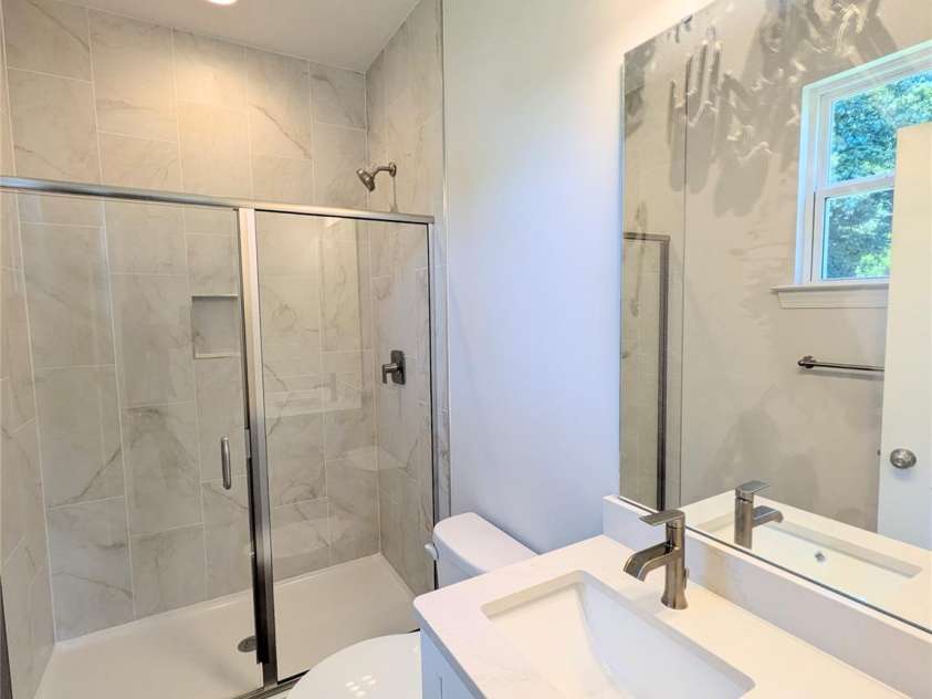 209 James Street, Kannapolis, NC 28083.  MLS# CAR4384719, YatesRealty ID 27580. Tiled shower in primary Bedroom