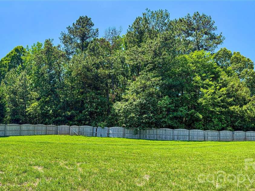 2408 Labelle Drive, Waxhaw, NC 28173.  MLS# CAR4358881, YatesRealty ID 27581. Additional land behind fence line