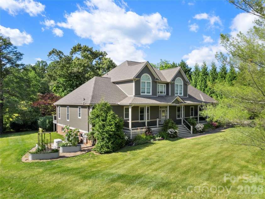 18 Brook Meadows Lane, Arden, NC 28704.  MLS# CAR4369649, YatesRealty ID 27586. Large yard with raised beds on side