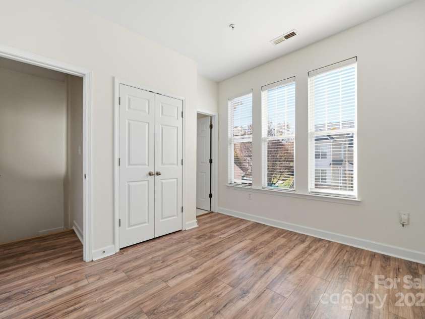 7119 Founders Club Court, Charlotte, NC 28269.  MLS# CAR4317437, YatesRealty ID 2759. Second bedroom with ensuite bathroom