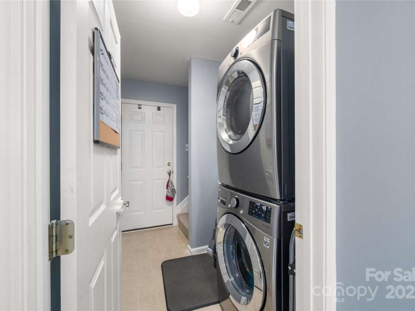 34 Dove Hollow Road, Fletcher, NC 28732.  MLS# CAR4279098, YatesRealty ID 27596. Laundry room with convenient access to the two car garage.
