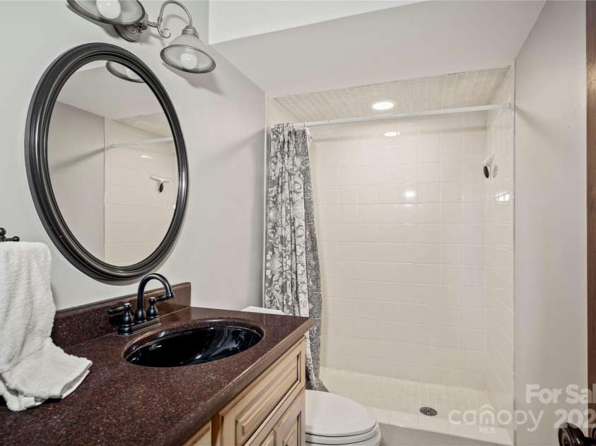 2045 Hogback Mountain Road, Tryon, NC 28782.  MLS# CAR4272415, YatesRealty ID 27598. 3rd BTHLower Level