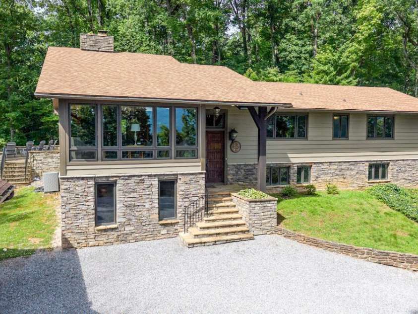 2045 Hogback Mountain Road, Tryon, NC 28782.  MLS# CAR4272415, YatesRealty ID 27598. Split Level 5 Br 4 BTH3 Car Garage