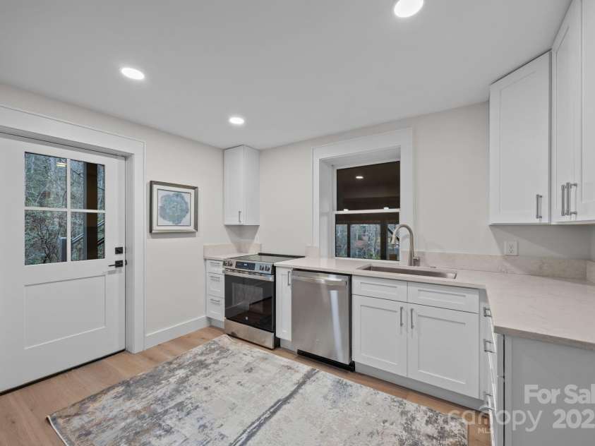 95 Cardinal Trace, Lake Toxaway, NC 28747.  MLS# CAR4317545, YatesRealty ID 27603. Lower Level Kitchen