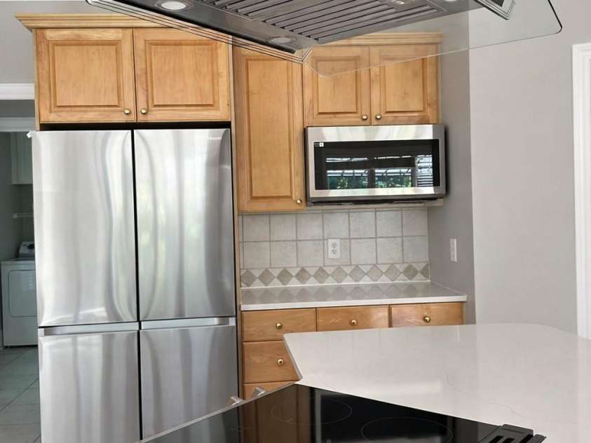 9220 Holly Hill Farm Road, Charlotte, NC 28277.  MLS# CAR4388039, YatesRealty ID 27610. Kitchen Range and vent hood