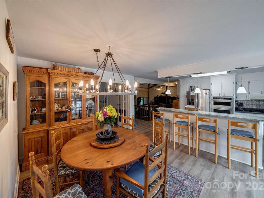 7411 Davis Road, Waxhaw, NC 28173.  MLS# CAR4278062, YatesRealty ID 27614. KITCHEN NOTE THE WAGON WHEEL CEILING LIGHT