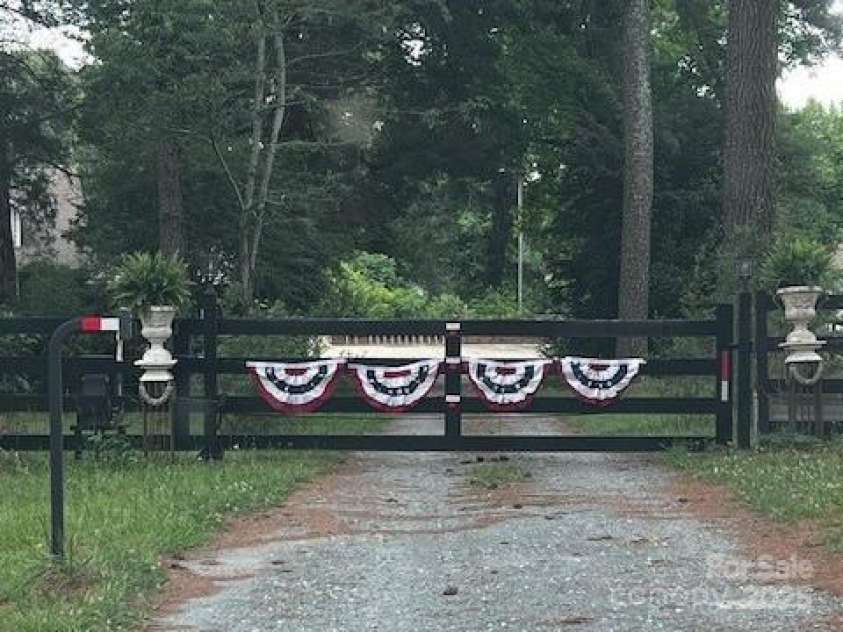 7411 Davis Road, Waxhaw, NC 28173.  MLS# CAR4278062, YatesRealty ID 27614. PROPERTY GATE IS SOLAR POWERED