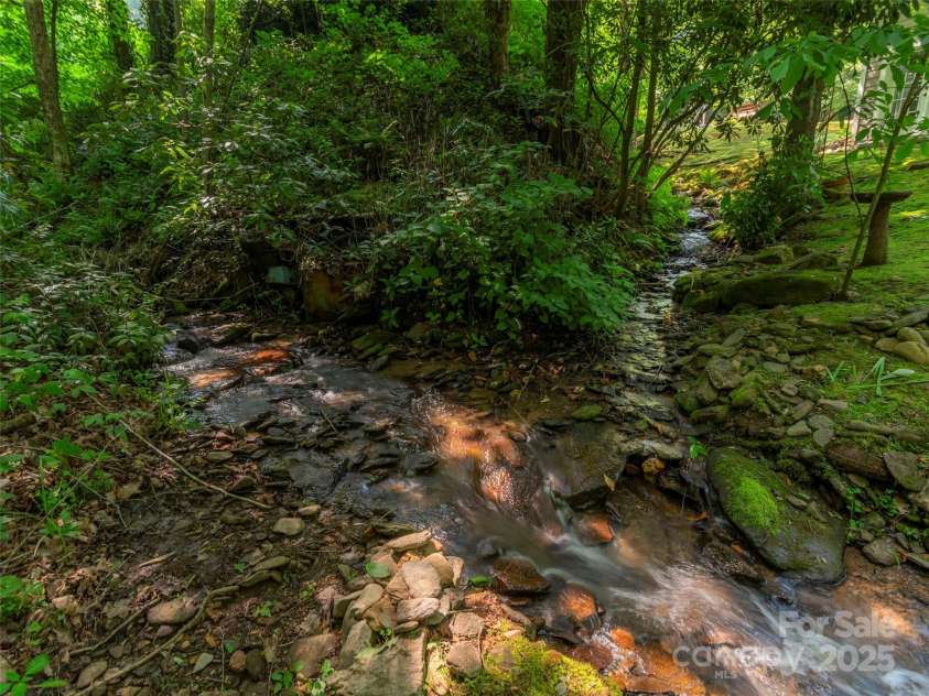 1131 Laurel Branch Road, Waynesville, NC 28785.  MLS# CAR4270498, YatesRealty ID 27622. Two-hearted creek on property